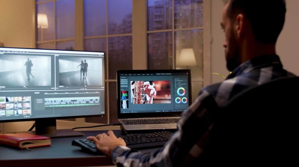 A man works on video post-production late at night