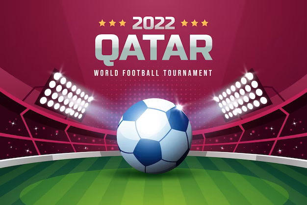 Soccer ball on a football field with the inscription Qatar 2022