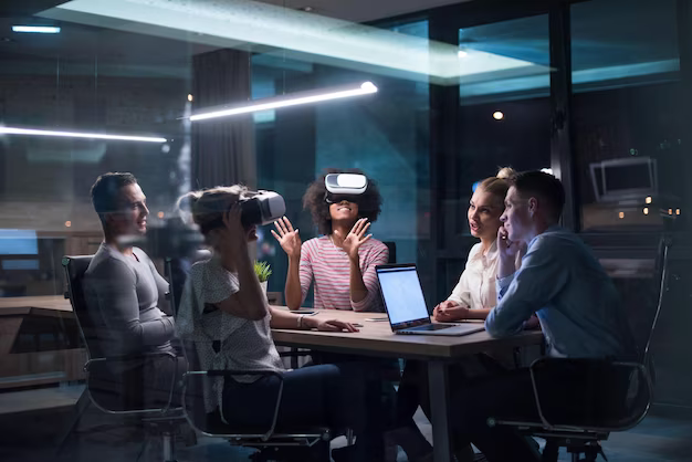 Group of people using virtual reality headset in office